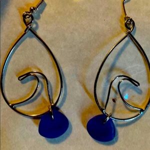 Silver wave earrings with dark blue sea glass